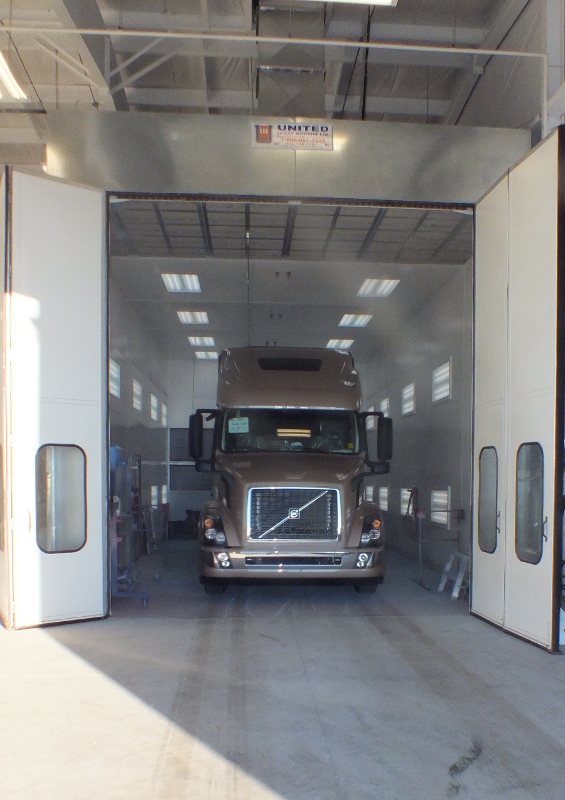 Gold truck in a work bay